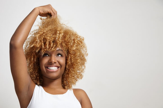 Avoid Heavy Creams and Further Damage With UV Protection on Permed or Bleached Hair